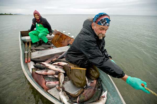 Fishermen net Salmon in the coastal waters of The Nushagak-Mulchatna watershed of Alaska. Image credit: Ami Vitale.