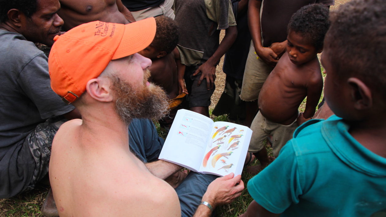 Eddie Game asks Musiamunat villagers about local birds-of-paradise. Photo © Justine E. Hausheer / TNC
