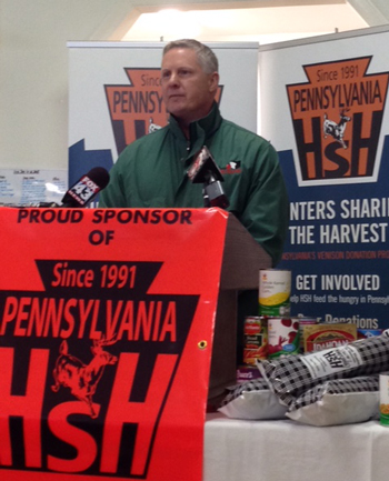 Joe Arthur of the Central Pennsylvania Food Bank receives donations from HSH. Photo © HSH
