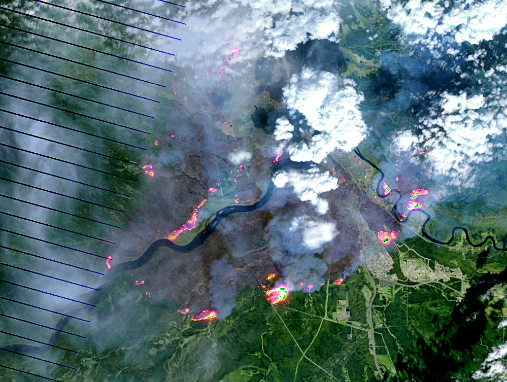 The Alberta fire has grown so big that it can be seen from space. This satellite image shows the fire hotspots in red and yellow, while smoke appears as white and the burn scar on the landscape appears as brown. NASA Earth Observatory image by Joshua Stevens, using Landsat data from the U.S. Geological Survey in the Public Domain