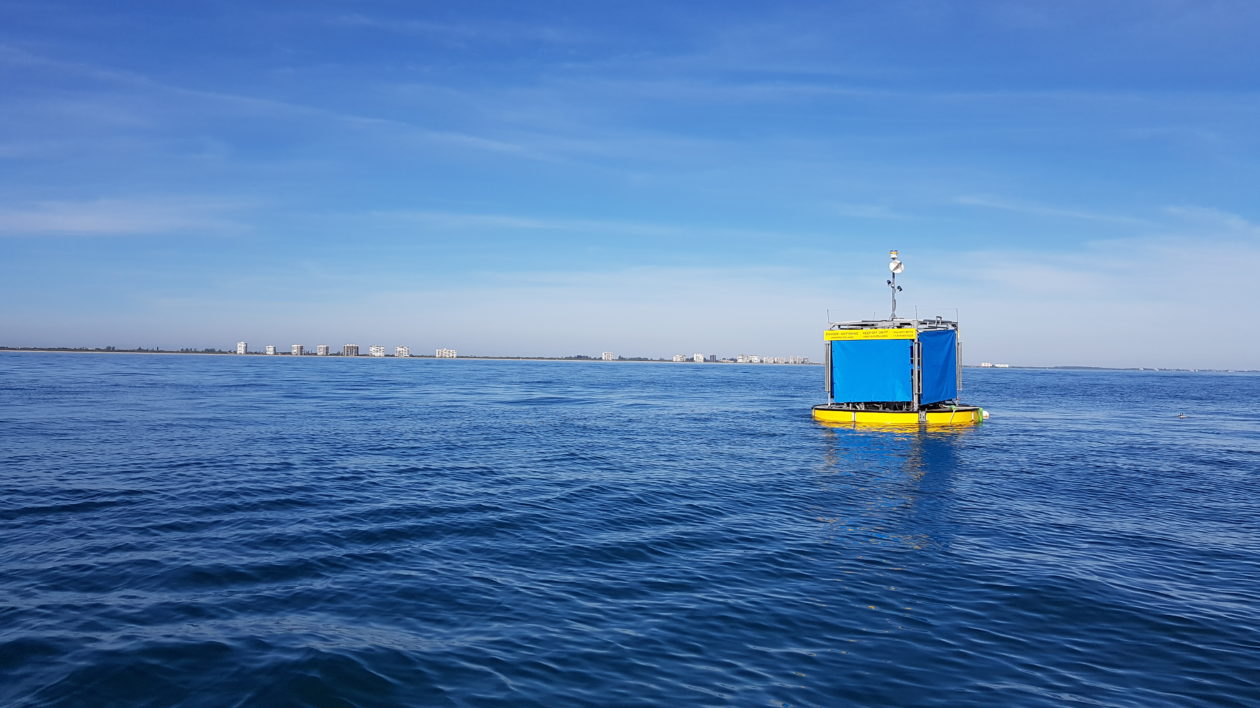 small blue and yellow device on open ocean