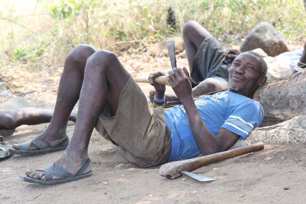 A Hadza community member relaxes after a morning of hunting and gathering. Photo: Matt Miller/TNC