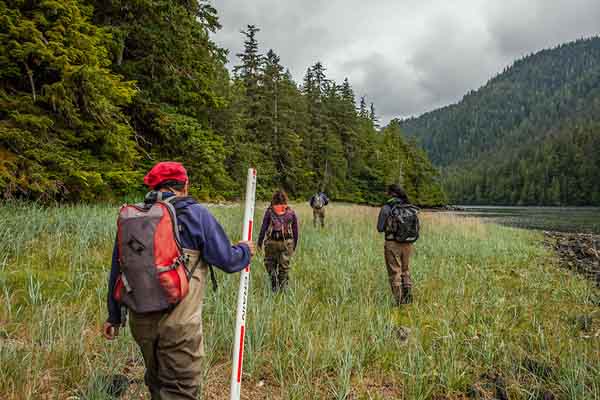 Tony Sanderson, Herbert Nix, Sonia Ibarra and Melanie "Minnie" Kadake perform fish surveys on streams at Keete's Inlet on Prince of Wales Island. Photo: © Erika Nortemann/TNC