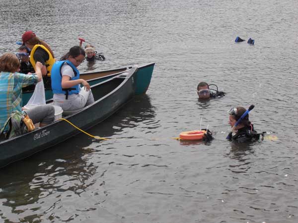 Scuba divers and surface crews with nets have proven effective in controlling Eurasian watermilfoil. Photo: Jerry Ziegler/TNC