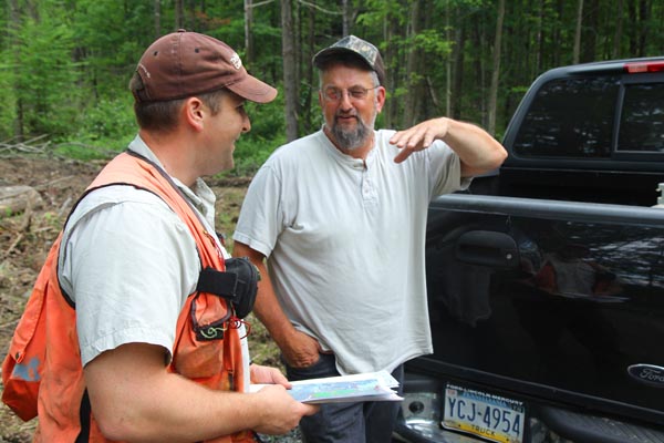 The Conservancy's Mike Eckley (left) discusses deer management with deer hunter Donald Hettinger. Photo: Matt Miller/TNC