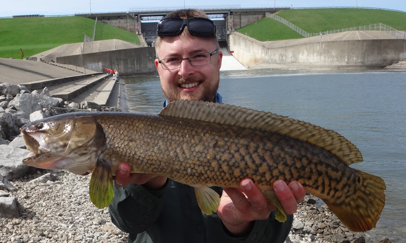 Ben Cantrell poses with a bowfin. 