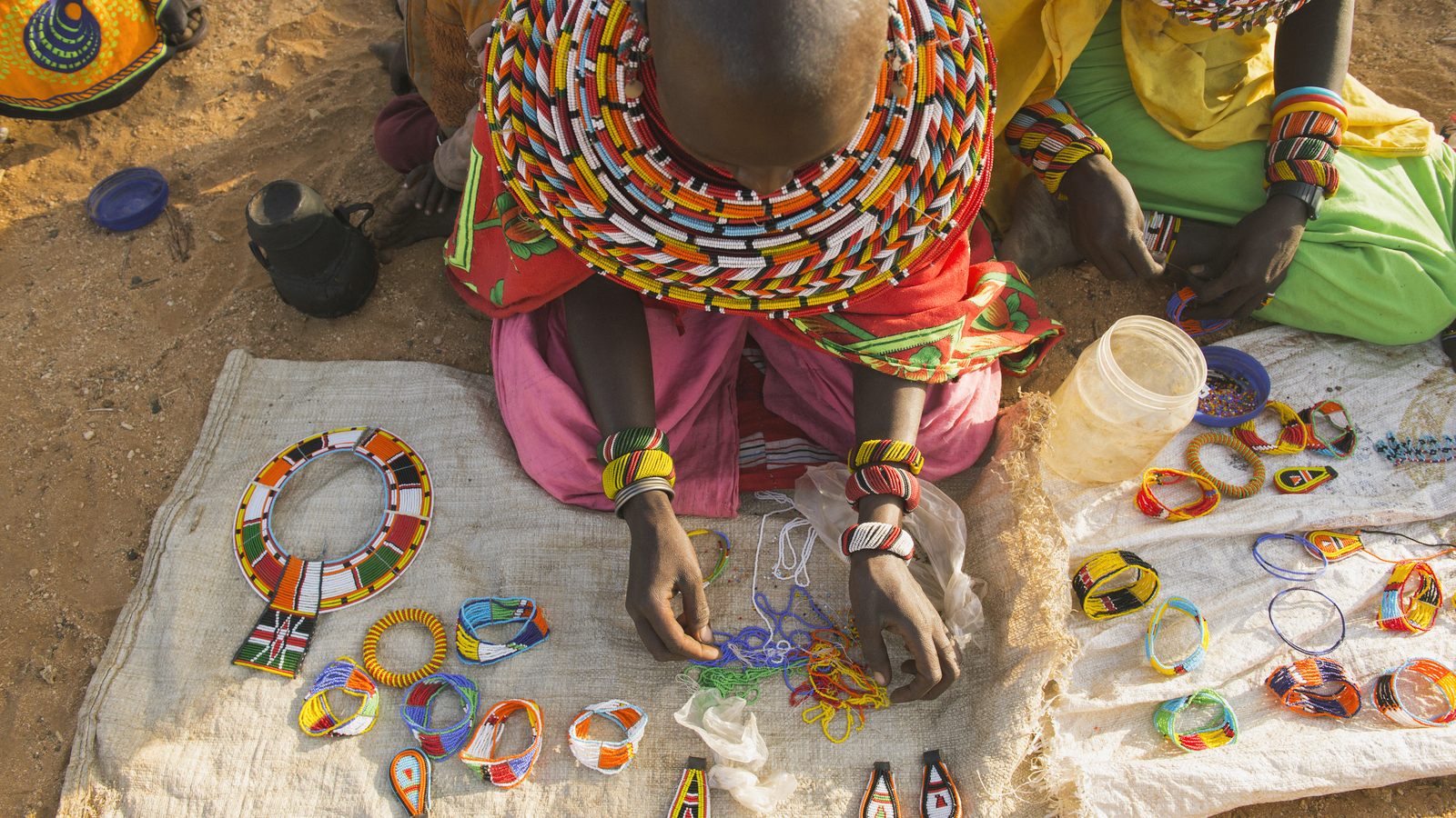 Samburu women make beaded products in West Gate Conservancy, Kenya. Northern Rangelands Trust (NRT) is focused on helping communities diversify their income. Photo © Ami Vitale for The Nature Conservancy