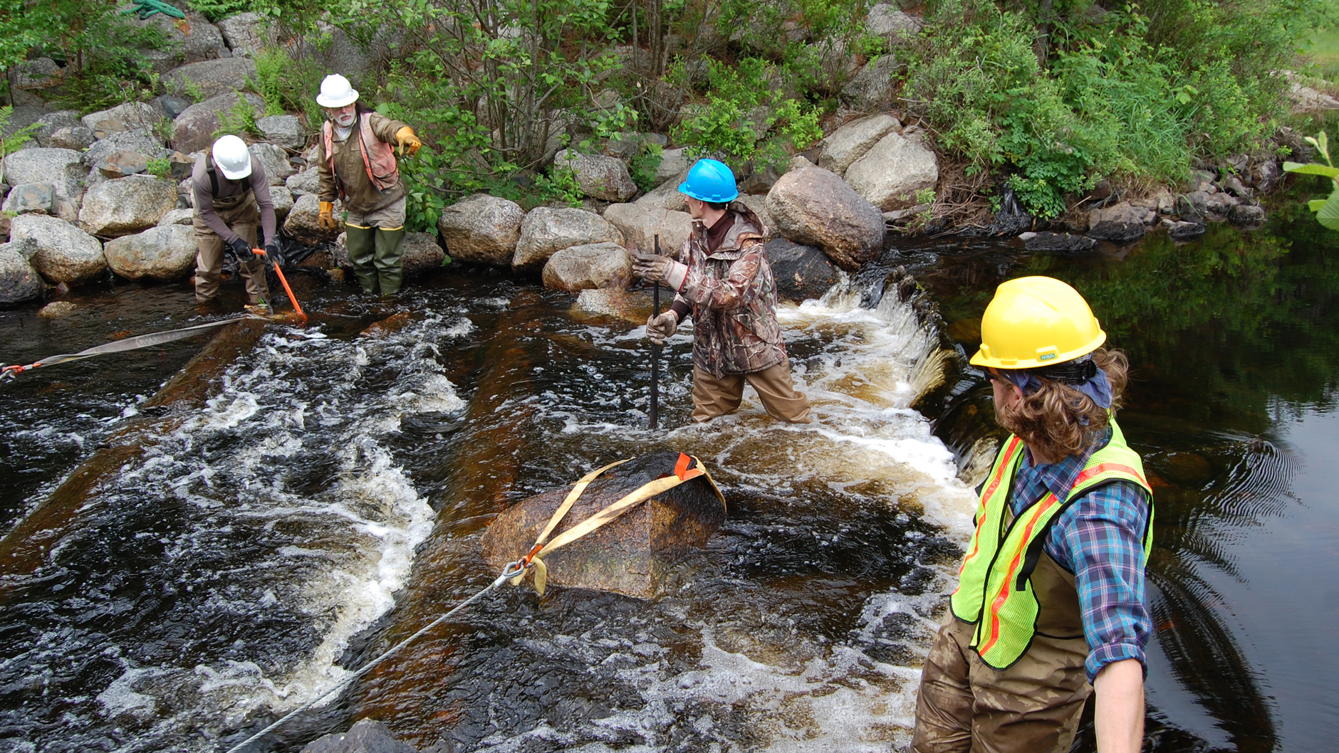 TNC, under direction of Project SHARE, with help from USFWS taking out Canaan Dam on the upper East Brach Machias River. Photo courtesy of The Nature Conservancy