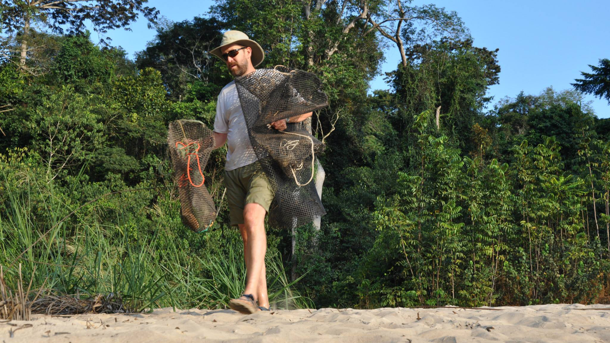 Sullivan prepares fish traps for the evening's mormyrid search.Photo © Brian Sidlauskas