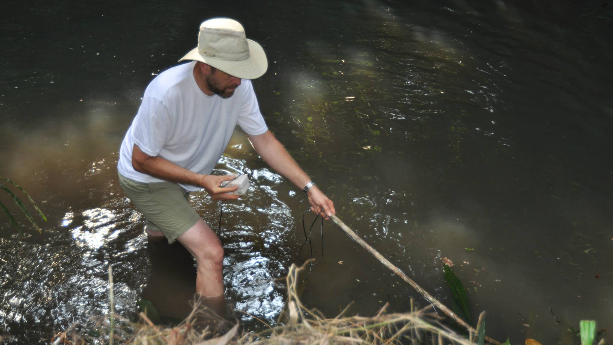 John Sullivan locating mormyrids with a fish finder. Photo © Brian Sidlauskas