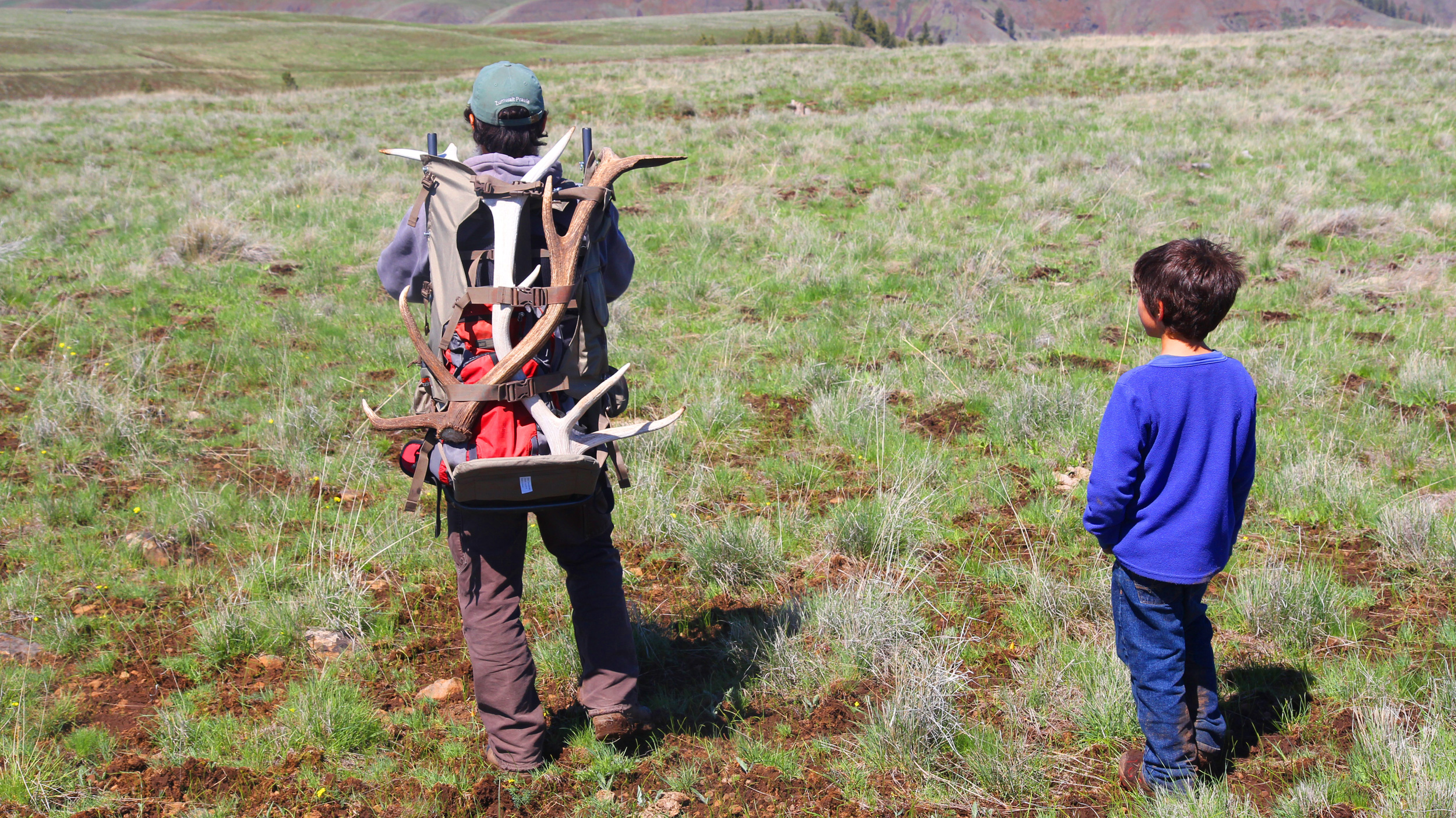 The Conservancy's Mike Beachy and his son search for antlers.  Photo © The Nature Conservancy (Matt Miller)