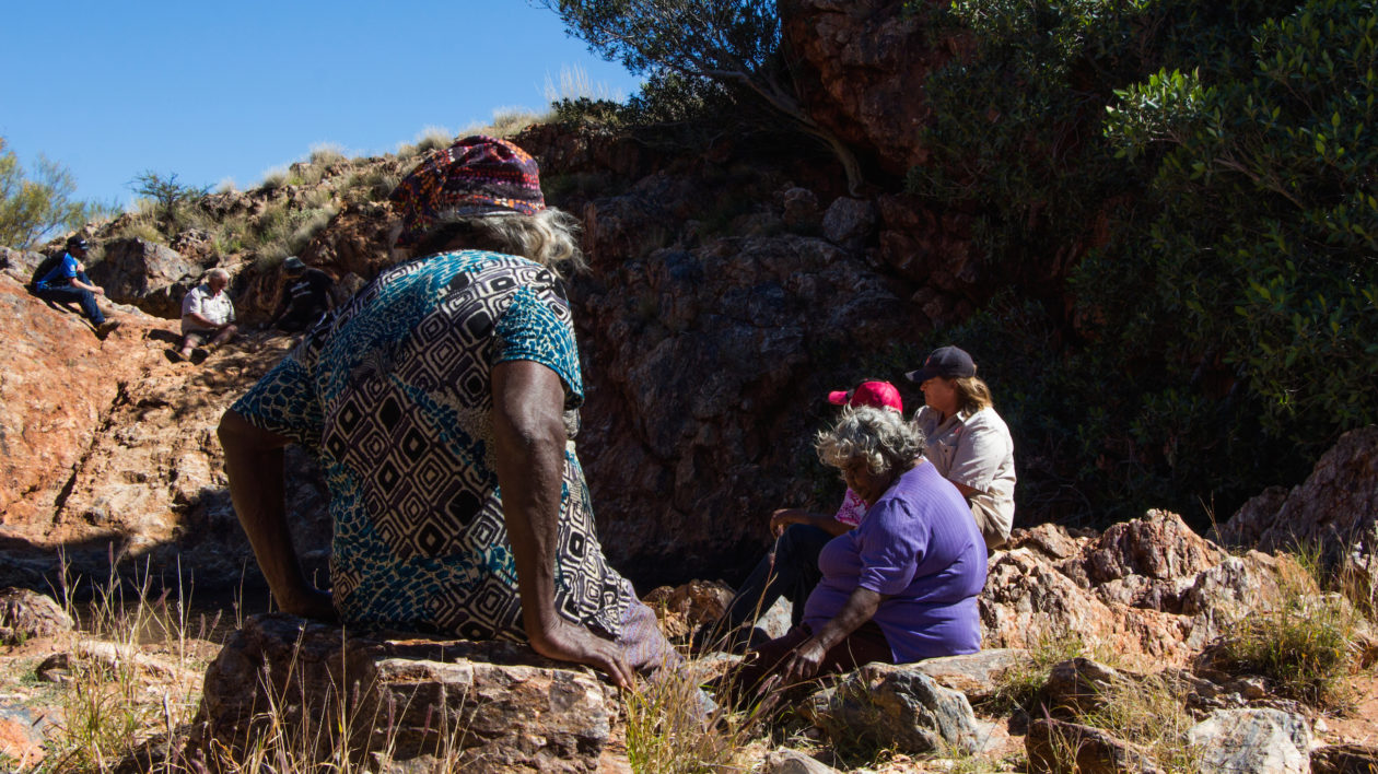 Martu elders Ngamaru Bidu and Thelma Judson at a desert waterhole. Photo © The Nature Conservancy (Justine E. Hausheer) 