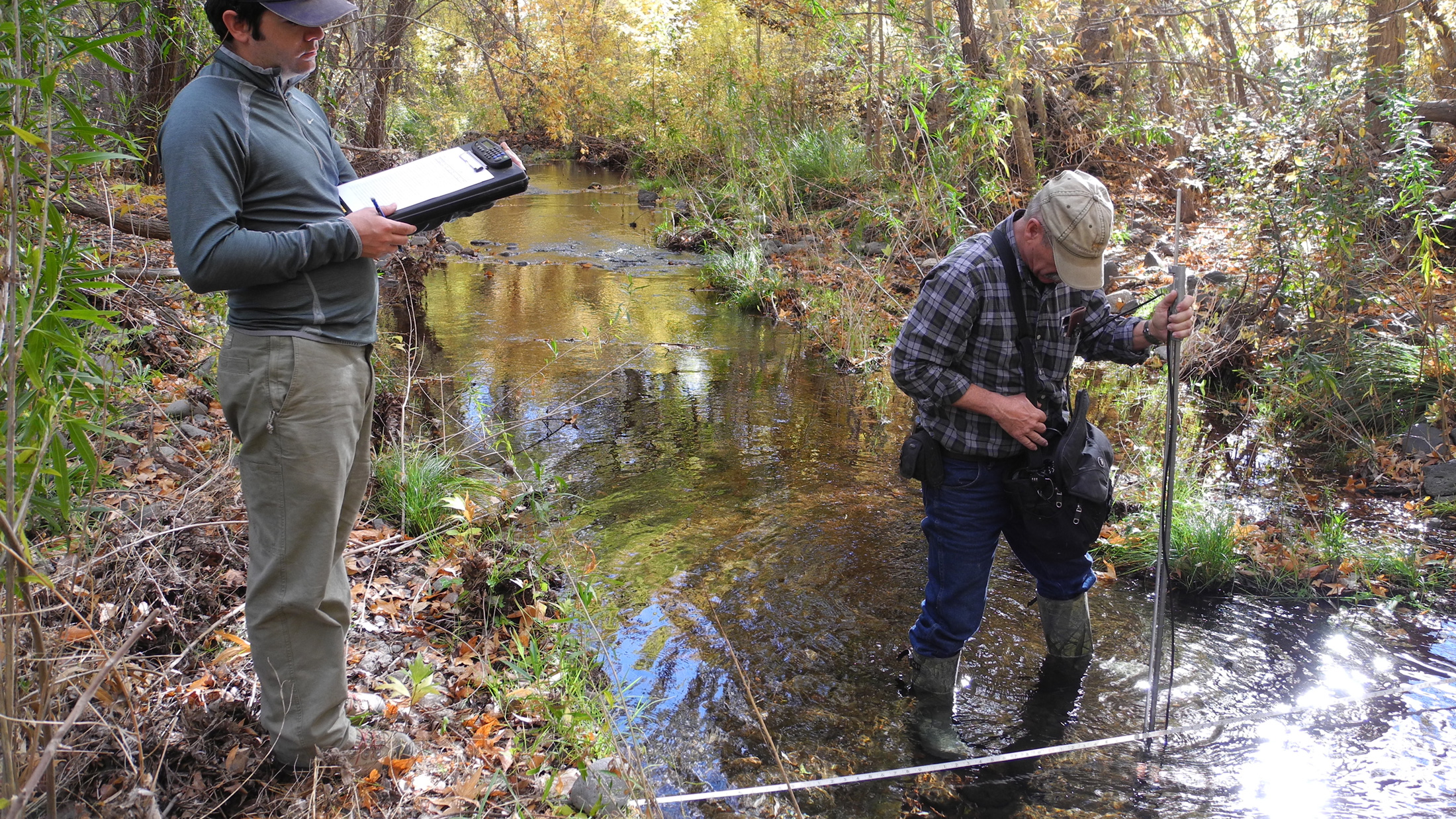 Ron Day and an Americorps intern stream monitoring at Muleshoe Ranch. Photo © The Nature Conservancy (Amy Zimmermann)