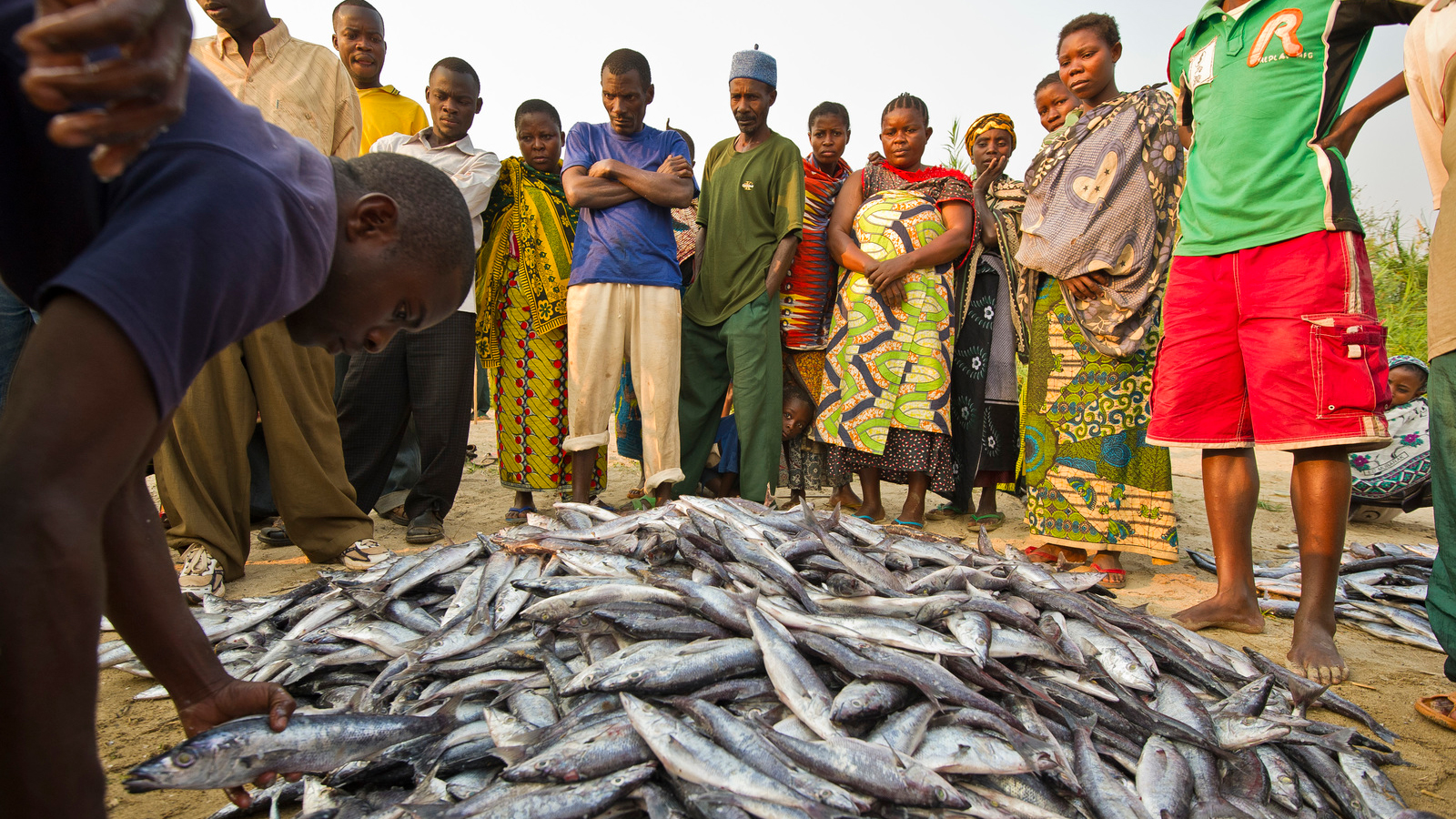Local village fisherman work to catch barely enough fish to make a living selling to the local market in the village of Katumbi on Lake Tanganyika in Tanzania. Photo © Ami Vitale