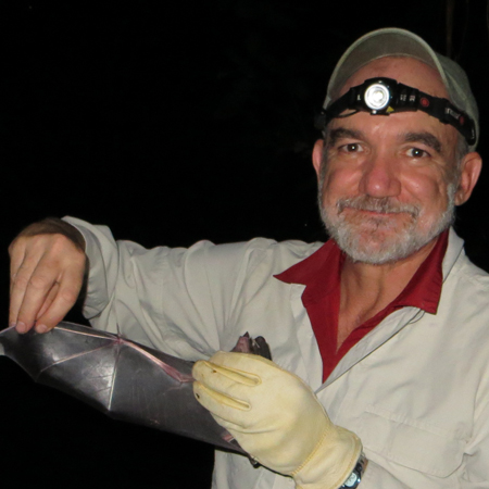 Rodrigo Medellín holding a bat. Photo © Marina Rivero