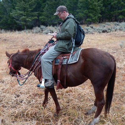 The author horseback writing on Natalie in a calm moment. Photo © Dayna Gross