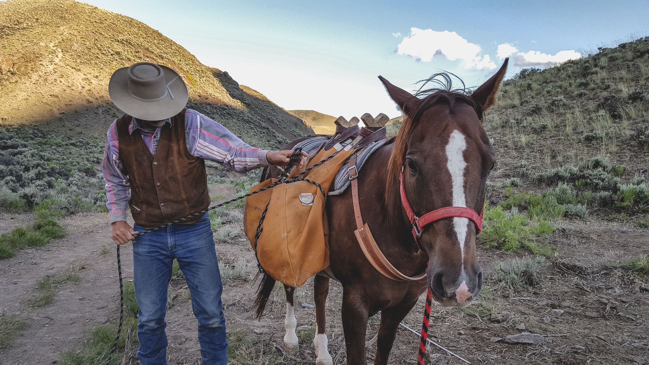 Glenn checks pack gear on Natalie at Magpie Camp #1. Photo © Melanie Elzinga