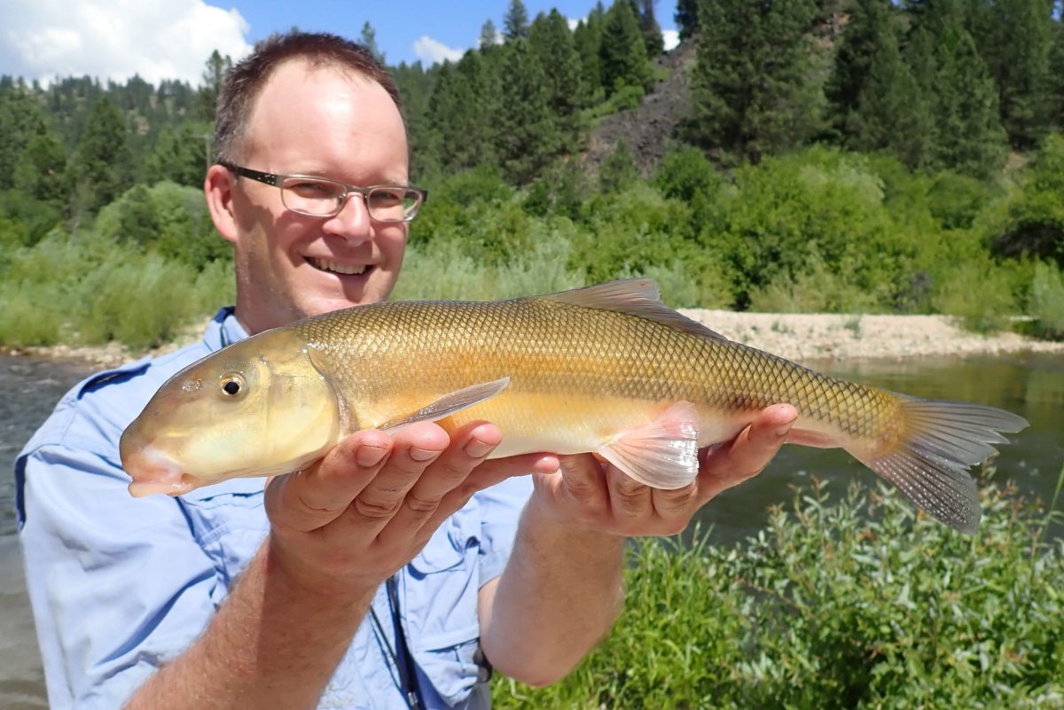 man holding a fish
