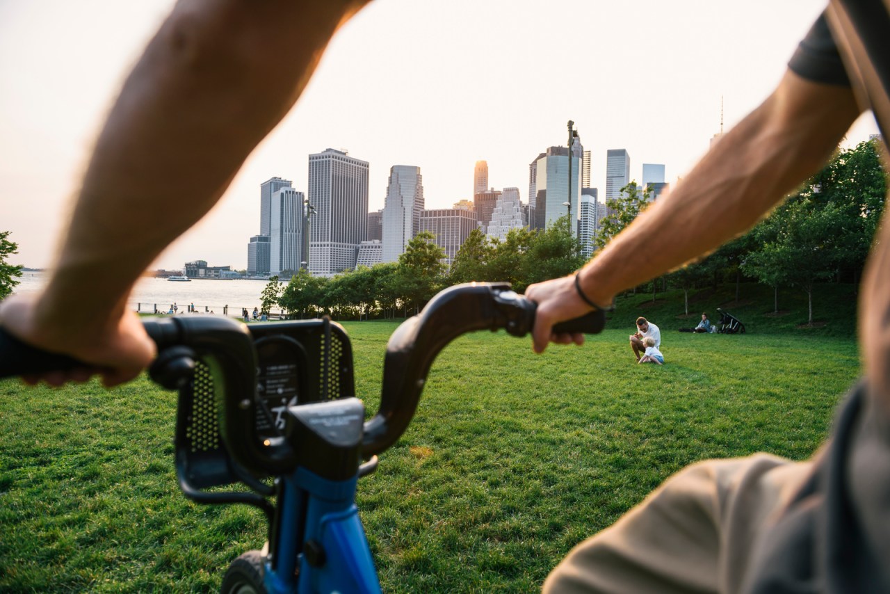 View of Manhattan from the perspective of a man riding a bike.