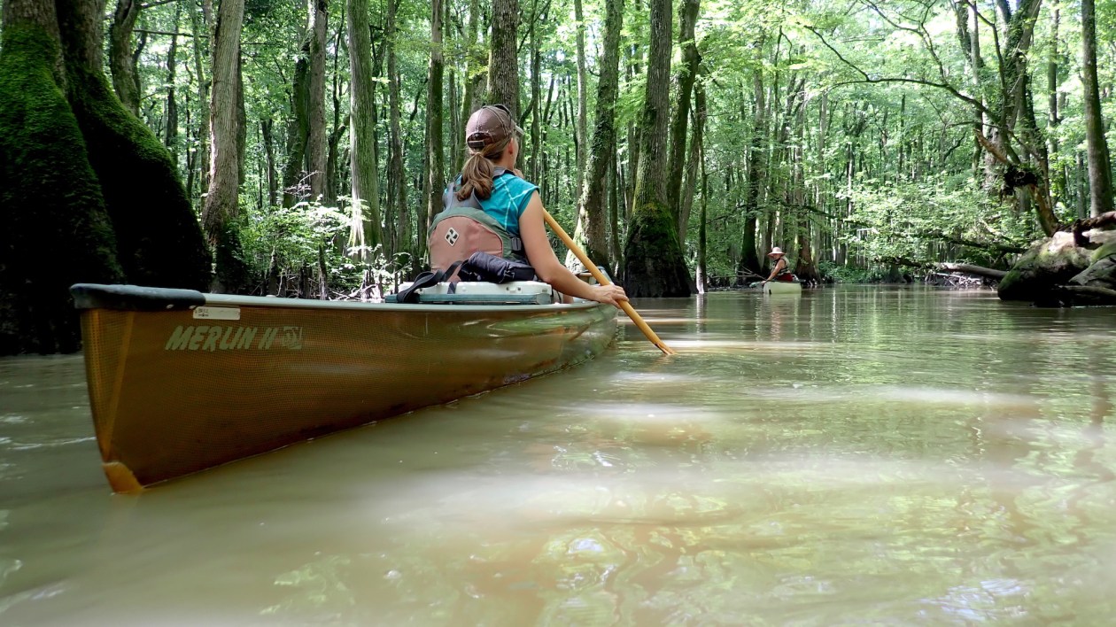 women in canoe
