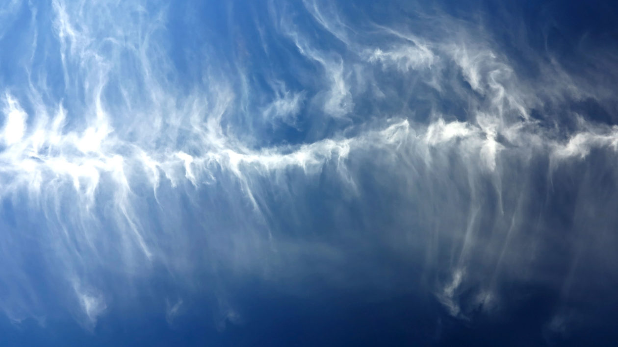 wispy clouds high in the sky