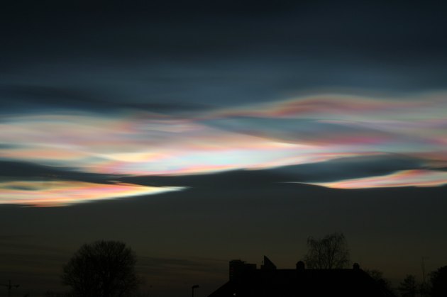 rainbow clouds on dark sky