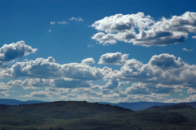 puffy clouds on blue sky