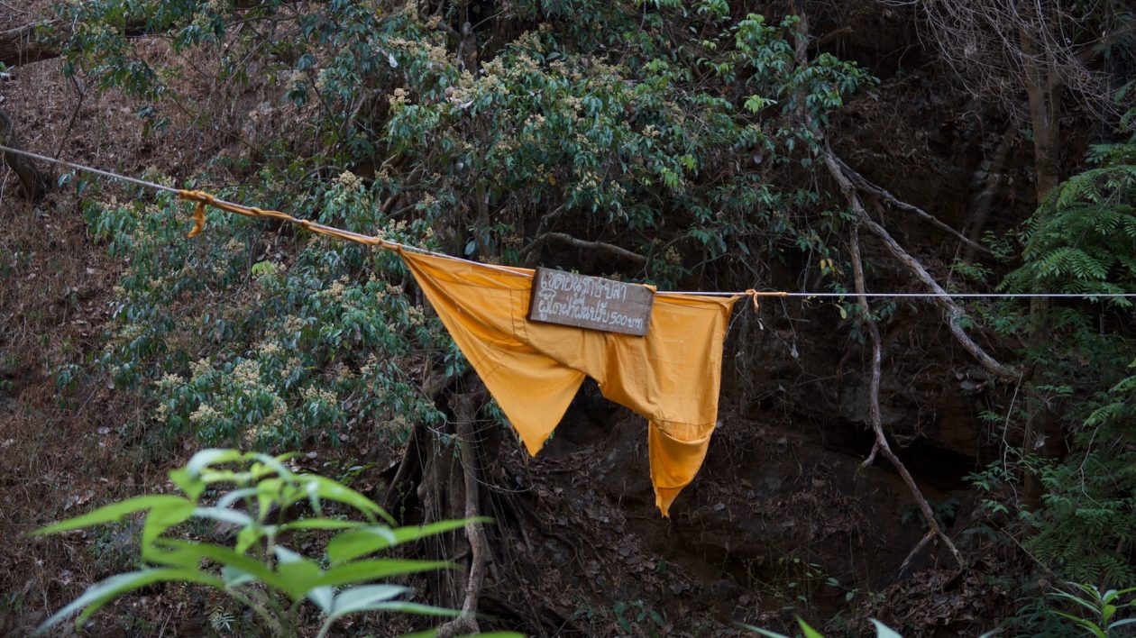 a yellow banner with thai writing