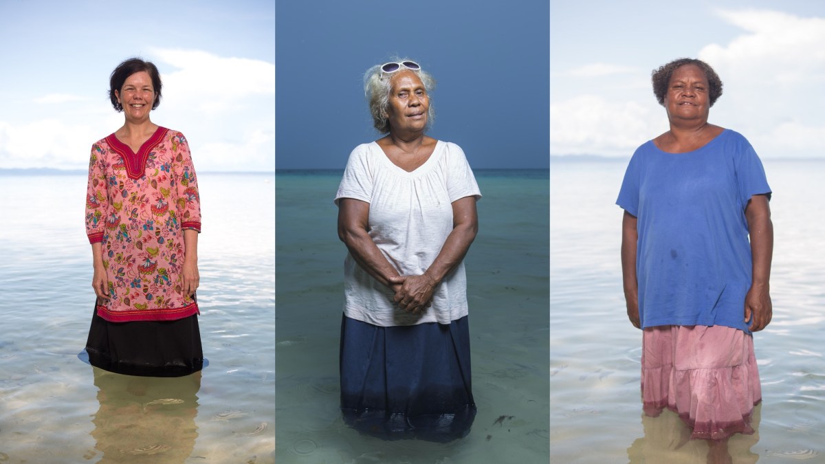 three women standing in the water