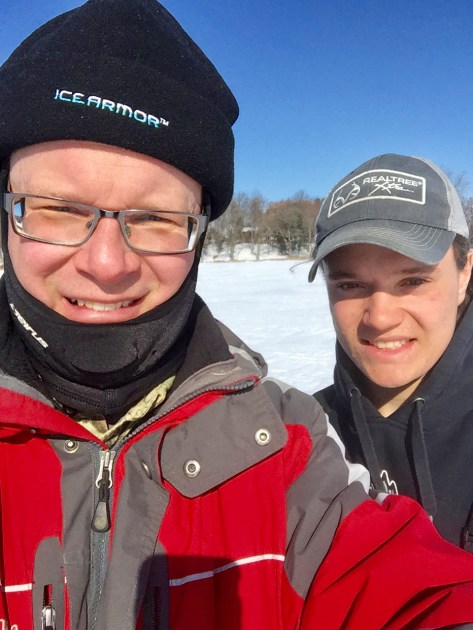 two men smiling into the cmera