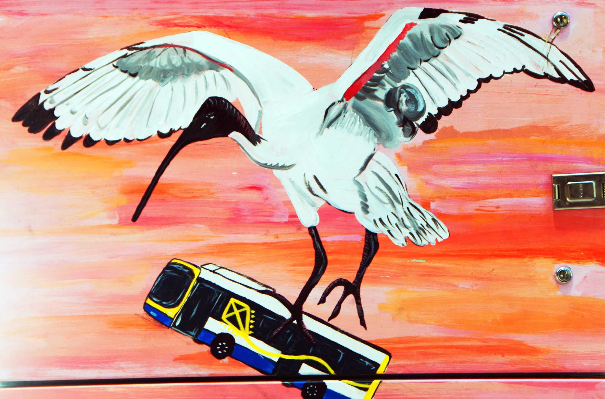 painting of bird carrying city bus