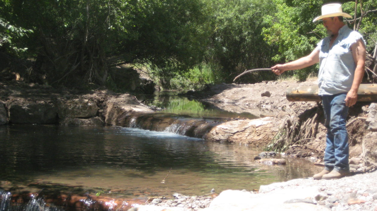 man fishing in a rock pool