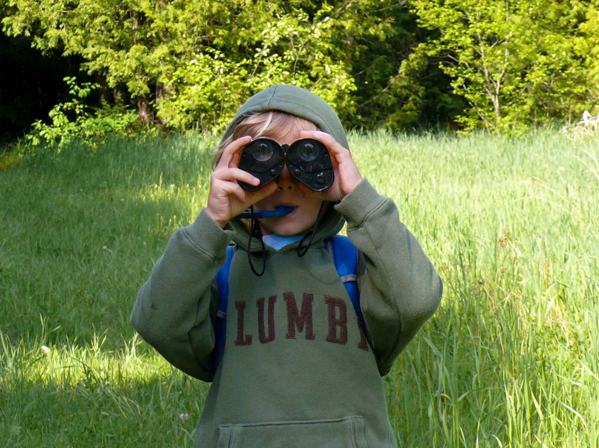 small child with binoculars