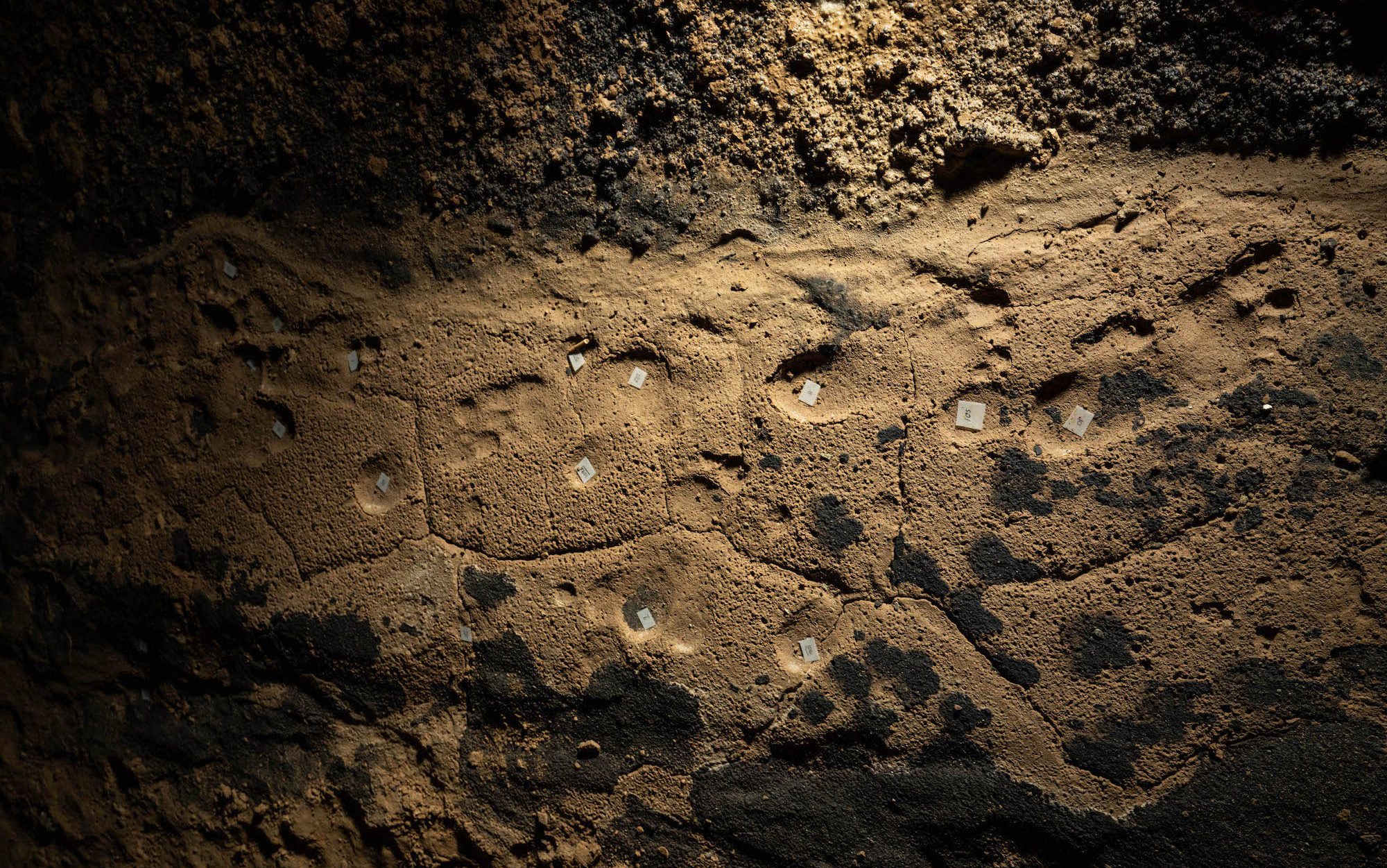footprints on a cave floor