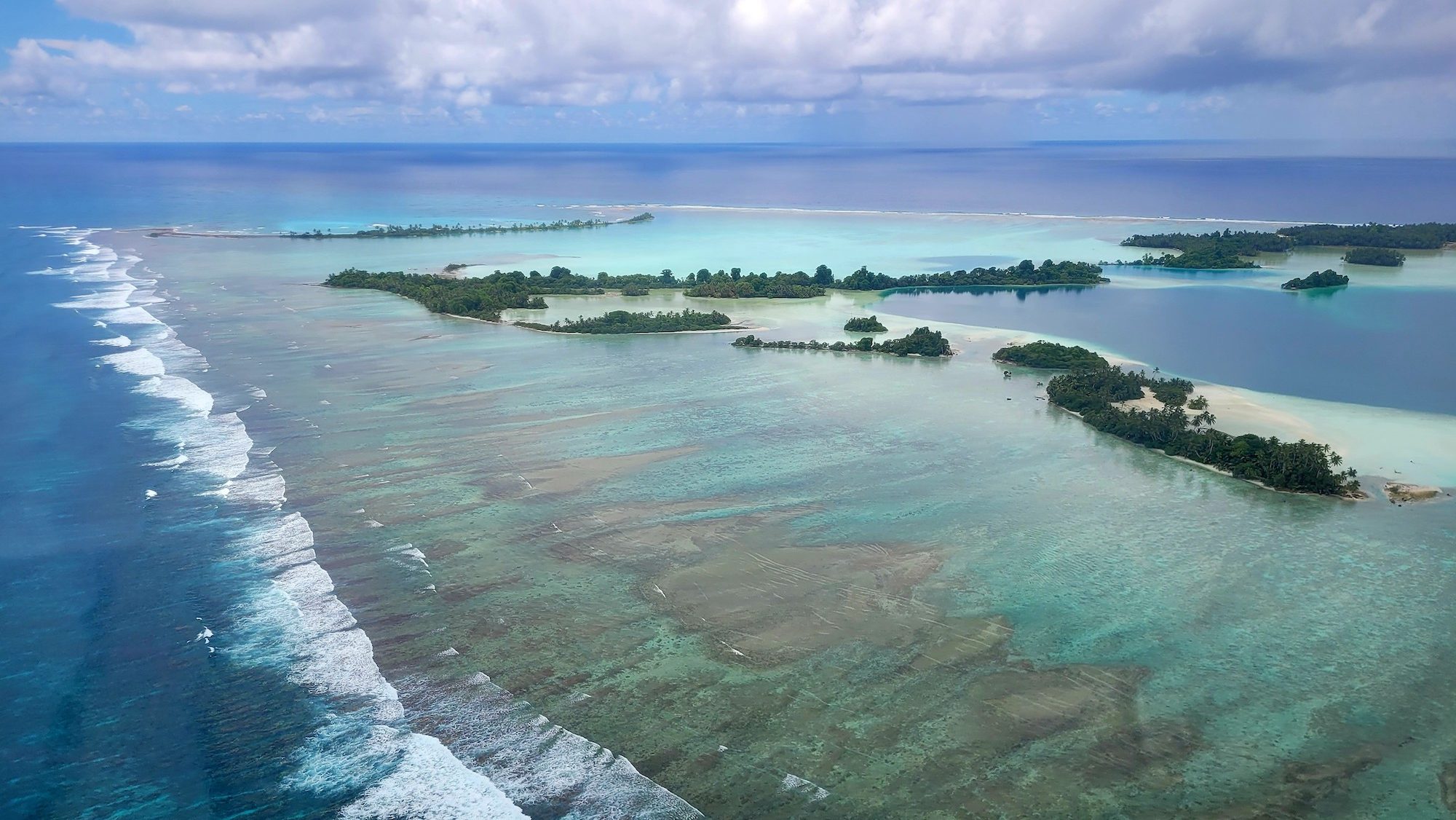 aerial view of Pacific atoll and coral reefs