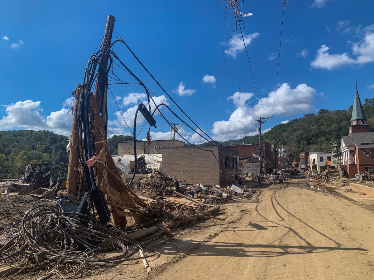 A view of a town street with storm destruction visible.
