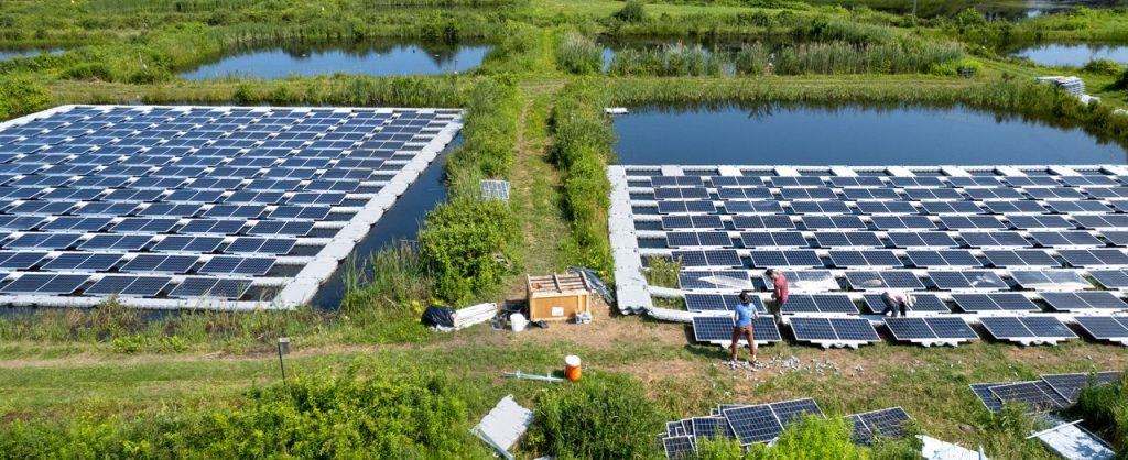 Image showing experimental solar panels being installed on ponds at Cornell University in upstate New York.