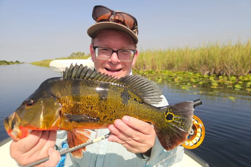 A man holding a large fish